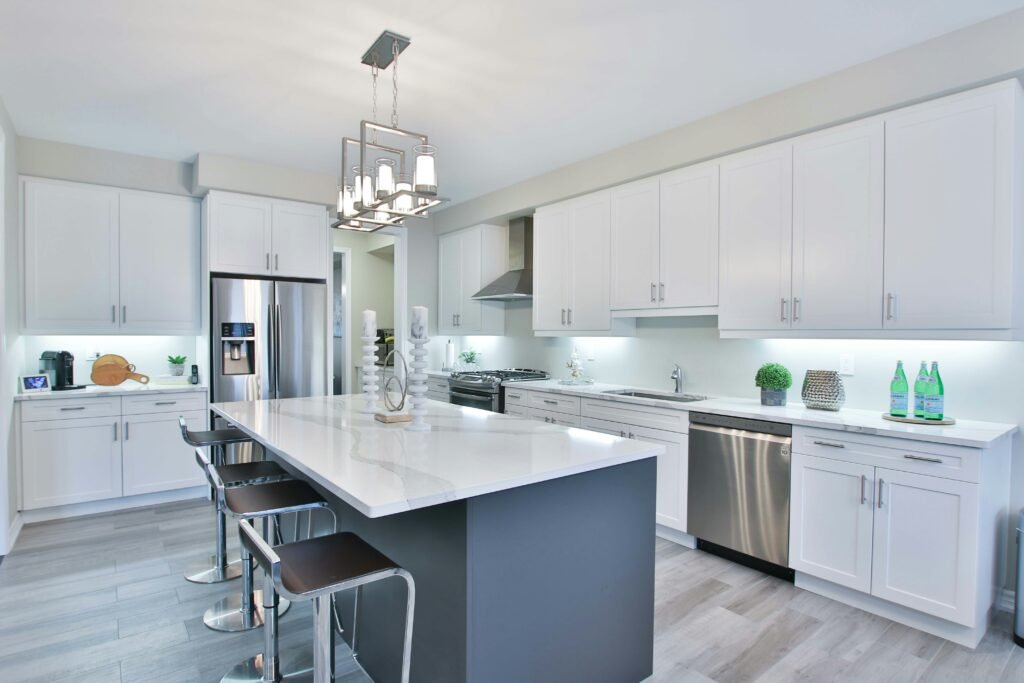 Contemporary kitchen design in Brookfield with custom cabinetry and an island breakfast bar