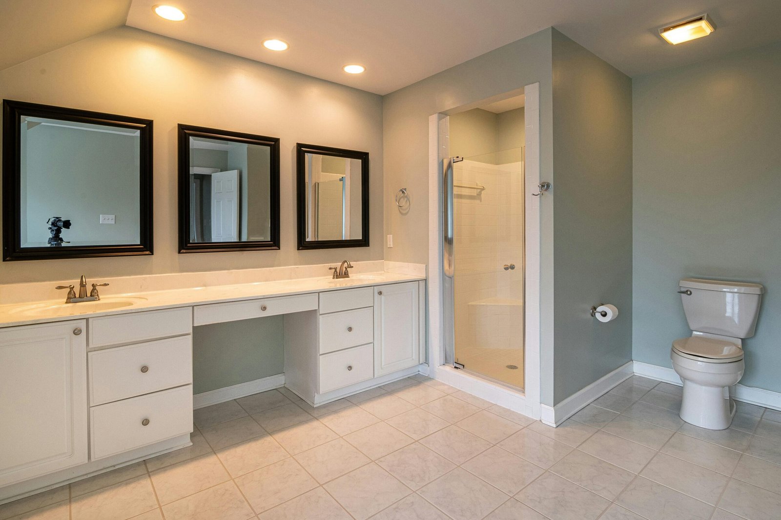 Eco-friendly bathroom with bamboo cabinets and natural stone sink.