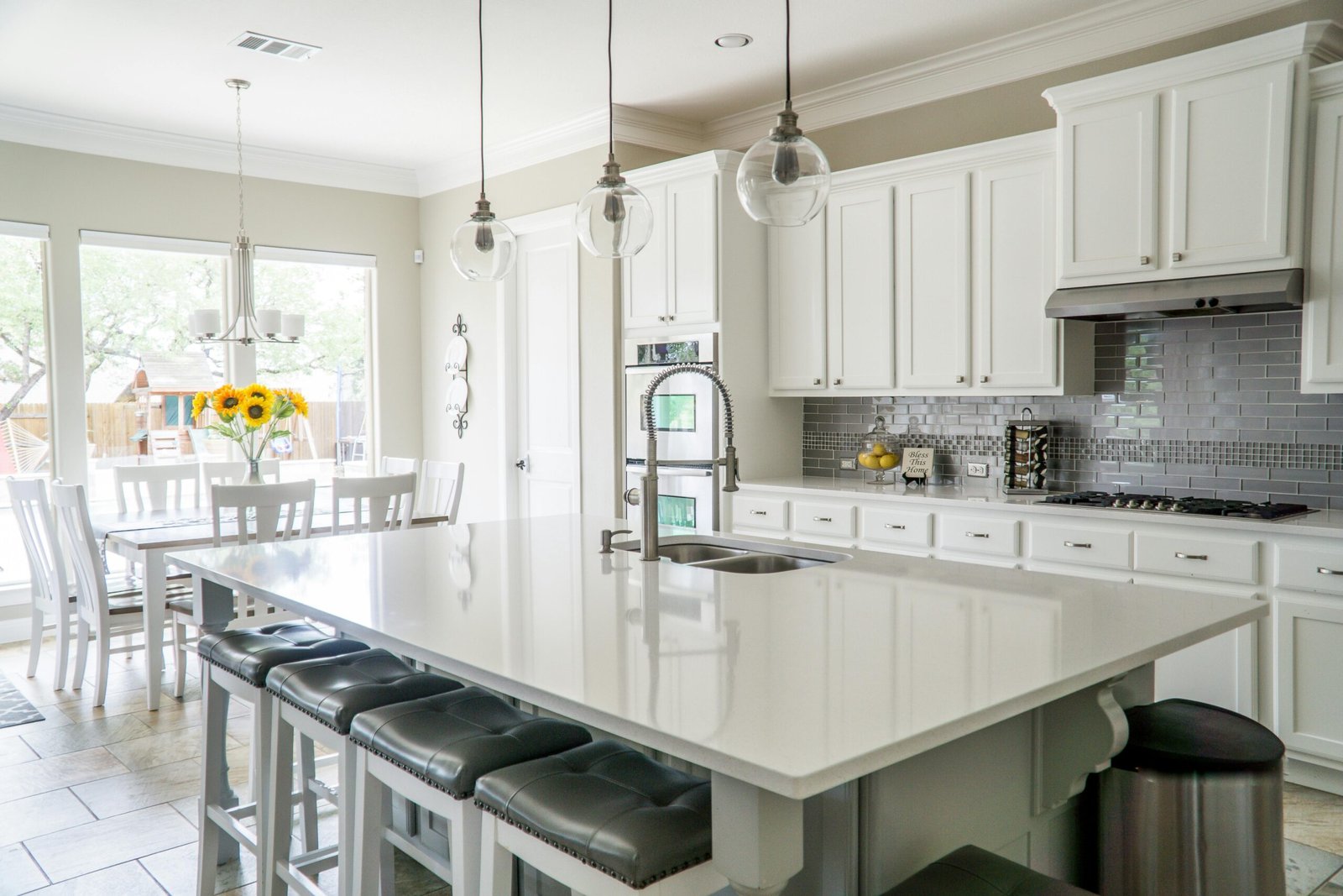 Spacious Milwaukee kitchen remodel featuring granite countertops and stainless steel appliances