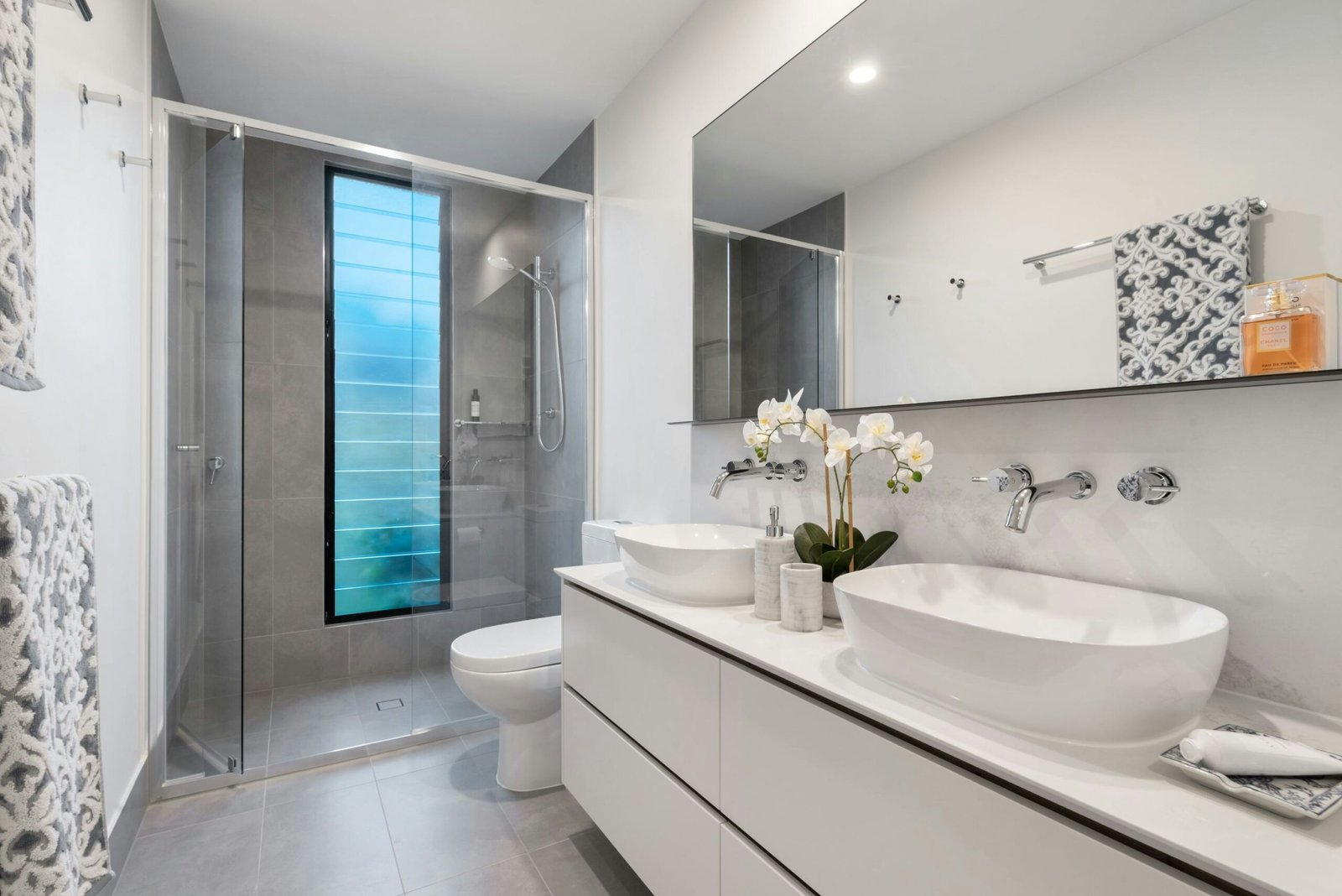 Spa-like bathroom retreat with a rain shower head and built-in bench seating