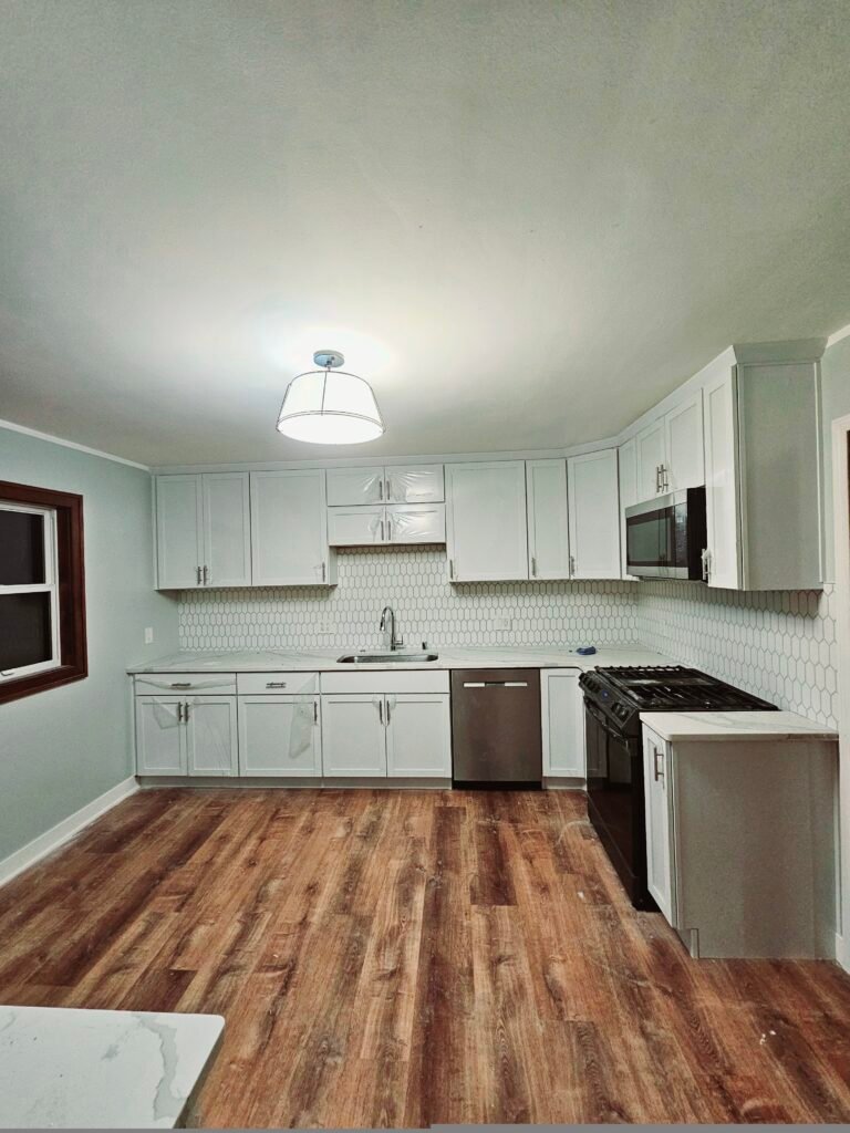 Bright and airy kitchen update in Shorewood, equipped with skylights and quartz countertops