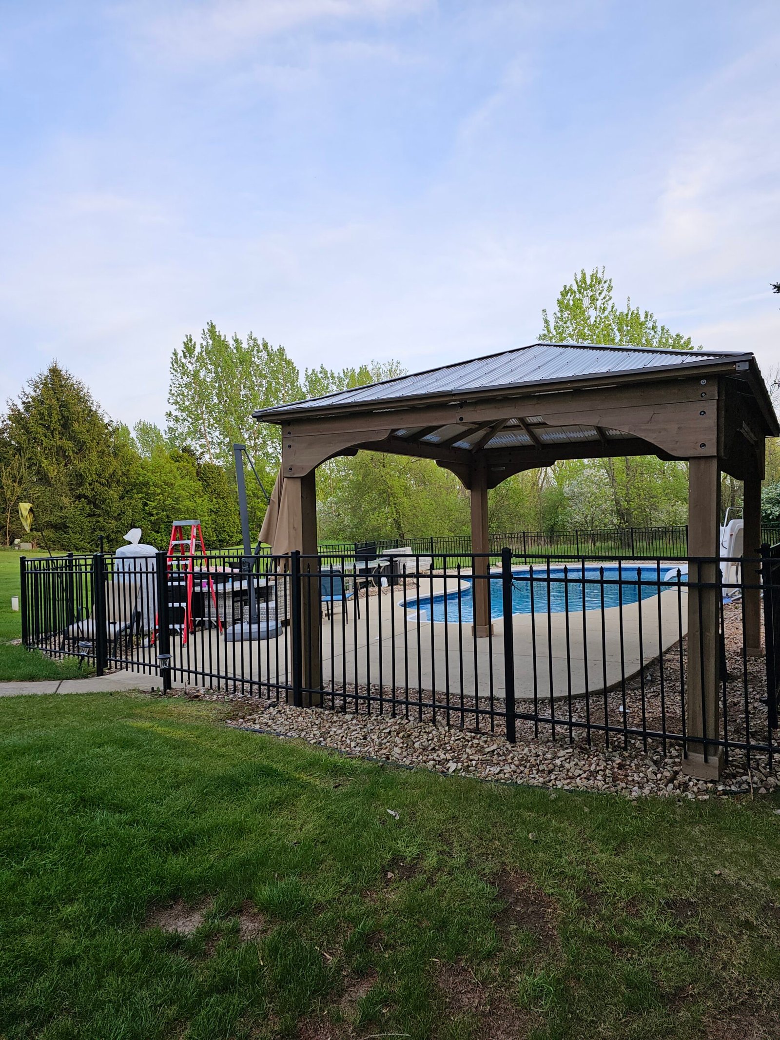"Inviting Milwaukee backyard setup with new pergola, perfect for family gatherings."