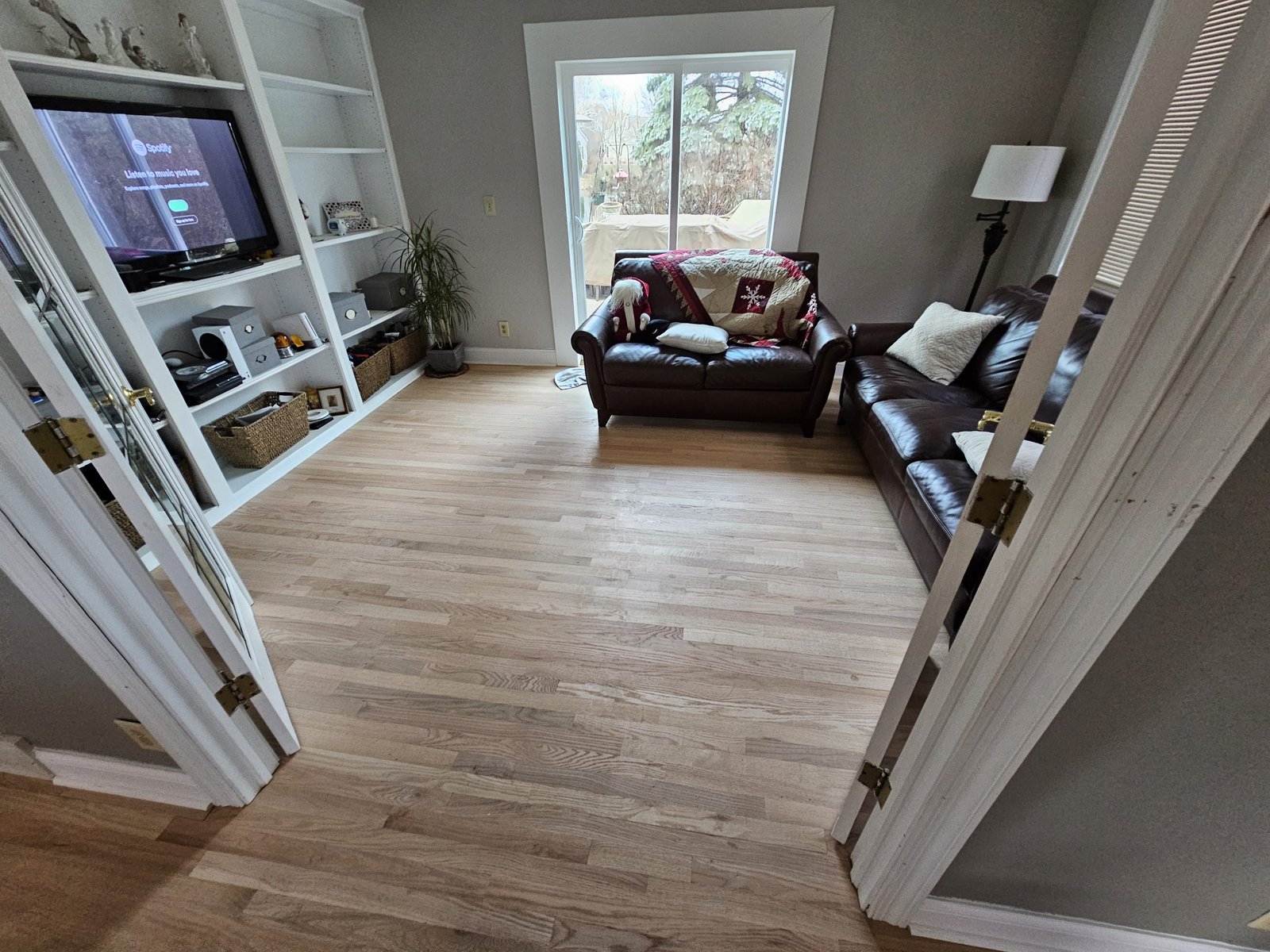 Elegant polished hardwood flooring in a spacious Milwaukee living room