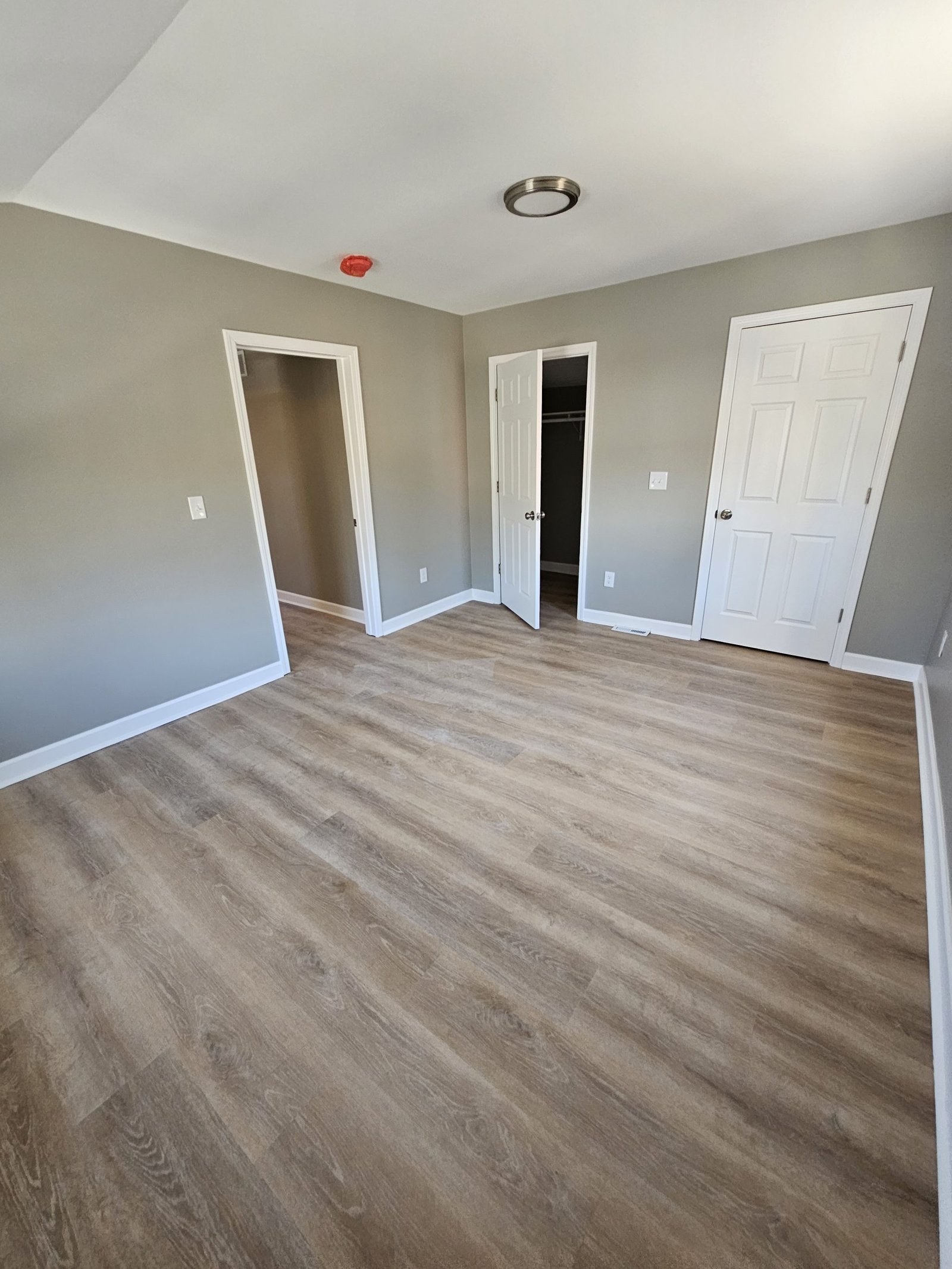 Richly stained hardwood flooring grafton wi installation in a classic Milwaukee home living room